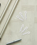 Rock Solid 12 Piece Blind Wand Replacement Hooks Built With Heavy Duty Alloy For Smooth Tilt Action And Fast Window Treatment Repairs Around Your Place on a wooden surface with rods.