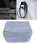 Heavy Duty Kickass Weatherproof Electric Vehicle Charger Cover Shields Wall Mounted Charging Station from Drenched Rain Snow and Harsh Sunlight Outside Grey Polyester Build, shown with rain.