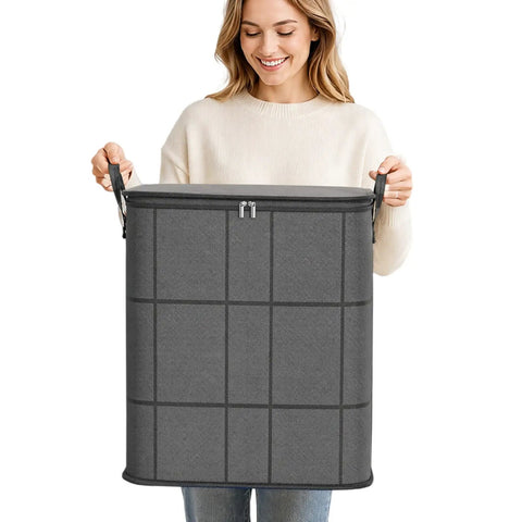 Massive Zippered Fabric Storage Bags Straight Up Heavy Duty And Foldable For Zero Fuss Home Organization No Sweat Closet Organizer Fits Bulky Bedding Seasonal Apparel And Gear, gray fabric storage bag held by a woman.