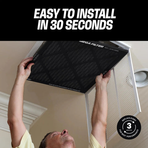 Person installing MegaFilter 20x20x1 Air Filter MERV 13 Activated Carbon Tech Defense in HVAC slot