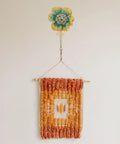 Sweet Vintage Flower Wall Hooks That Are Dang Handy For Hanging Coats Keys And Kitchen Towels Without Taking Up Valuable Space Plus The Rustic Design Looks Totally Legit In Any Room with colorful flower above woven wall hanging.