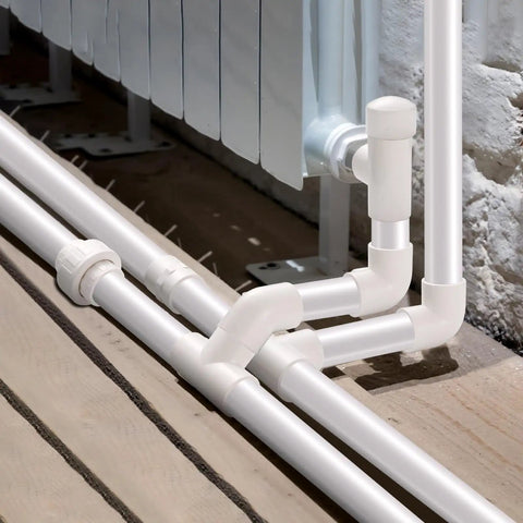 Heavy Duty 1 Inch PVC Union Fitting Socket To Socket Pack Of 10 for DIY projects showing installed Schedule 40 PVC pipes.