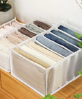 Wardrobe Upgrade Alert Killer 7 Grid Pants Organizer Box For Closet Drawer Sorter displaying stacked trousers in seven slots.