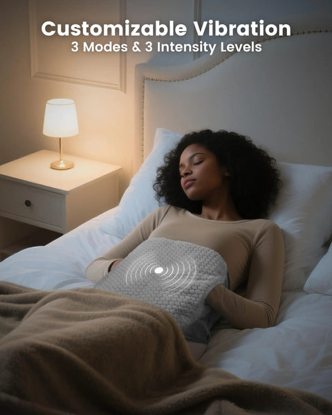 Woman using Extra Large Heating Pad With Massager For Back Pain And Cramps Auto Shut Off Corded Heated Waist Belt in bed