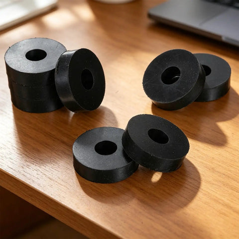 Pack of eight Heavy Duty Rubber Isolation Mounts And Anti Vibration Pads Built Mean To Crush Appliance Rattle on wood surface.