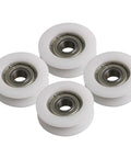 Four Pc U Groove Pom Pulleys With Eight mm Bore And 34 mm Outer Diameter displaying white POM wheels with inner bearings.