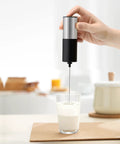 Mini Handheld Milk Frother Wand With Stainless Steel Whisk Power Packed 13,000 RPM Battery Powered Drink Mixer in glass