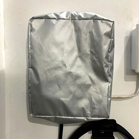 Shield Your Sweet EV Ride With This Tough As Nails Weatherproof Outdoor Charging Station Cover Oxford Wall Connector Box mounted on wall.