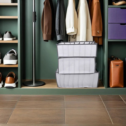 Total Closet Game Changer 3 Pack Seven Grid Foldable Bins With Grippy Handles in closet for organized storage.
