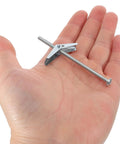 Hand holding part of 24 Piece Toggle Bolt Kit For Drywall With Wing Nuts And Boxed Set, No Fuss Install Anchors In Carbon Steel And PP Materials