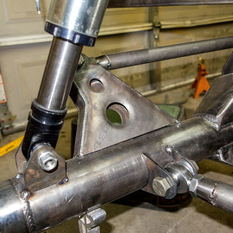 Badass Trail Ready 7 8 Inch Left Thread Heim Joint Kit With Chromoly Weld Bung Tube Adapter and Jam Nut shown installed on UTV frame.