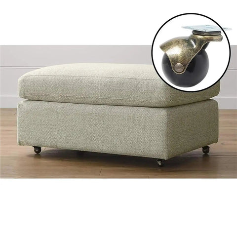 2 Inch Vintage Brass Swivel Caster Wheels Equipped With Reliable Roll Lock Brakes Set Of Four mounted on an upholstered ottoman.