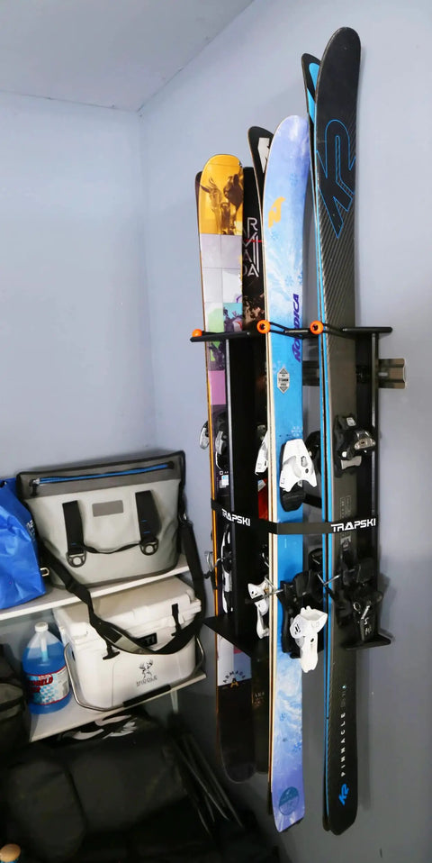 Heavy Duty Wall Mounted Ski And Snowboard Storage Rack Constructed From Durable Aluminum Frame with skis organized vertically.