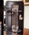 Inside view of the Fire Extinguisher Mini Bar With Concealed Liquor Cabinet To Stash Your Top Shelf Booze, showing shot glasses and storage shelves.