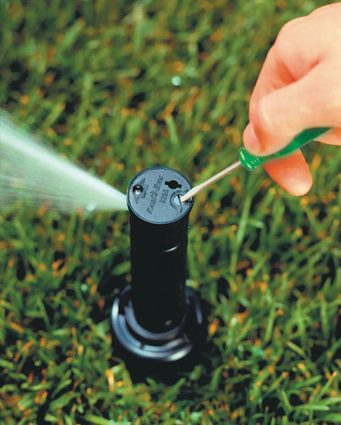 Adjusting Nozzle Pack 32SA Replacement Set Of 6 Self Aligning Sprinkler Nozzles in use on lawn for irrigation