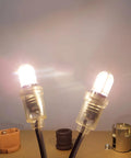 Two Top Tier Dope E10 LED Light Bulbs 5 Pack 6V Cold White 6500K showing clear covers and miniature screw bases.