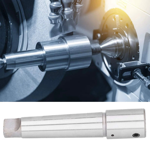R8 Morse taper arbor sleeve drill adapter in polished steel with wrench, shown mounted on a lathe spindle