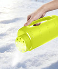 Handheld Do It All Lawn Spreader, 90oz Capacity, Multi Purpose Tool For Fertilizer, Grass Seed, Ice Melt And More, Easy Adjustable Openings For Precise Coverage, Green in use on snow
