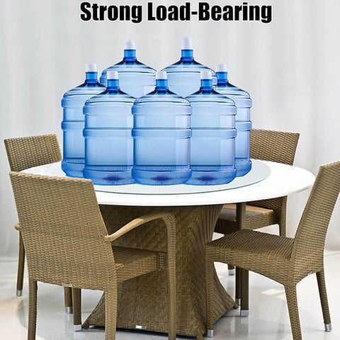 Dang Solid Heavy Duty Tempered Glass Lazy Susan Turntable For Family Dinners And Backyard Hangouts Killer Smooth Rotating Serving Tray With Ball Bearing Base displayed on a circular table with blue water bottles.