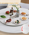 Hella Durable 40 Inch Lazy Susan Rotating Serving Tray Cut From Thick Sintered Stone With A Smooth As Butter 360 Swivel Design That Is Truly A Kitchen Game Changer For Big Family Gatherings In Clean Black set with food and drinks on a dining table.