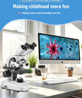 Binocular Compound Microscope 40X-2000X With Dual Mechanical Stages next to a computer, showcasing digital imaging capabilities.