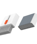 Amazon camera cleaning kit; white two-piece set with orange-button brush and gray foam pad