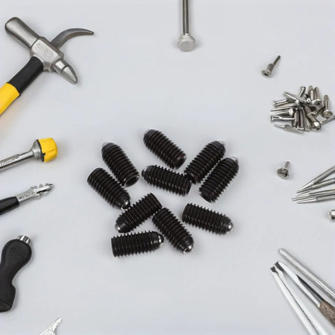 Heavy Duty Carbon Steel Hex Socket Spring Ball Plunger Screws For Clamps 10 Piece Pack arranged among tools on a flat surface.