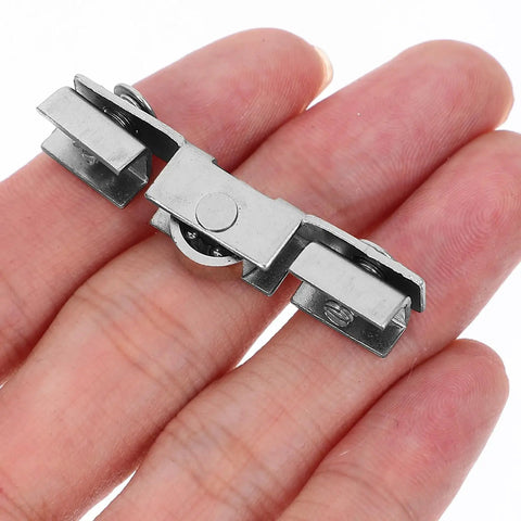 Top Notch Eight Piece Glass Door Roller Kit Featuring Heavy Duty Steel H Type Roller Wheels With Silent Double Bearing Mechanism shown in hand.