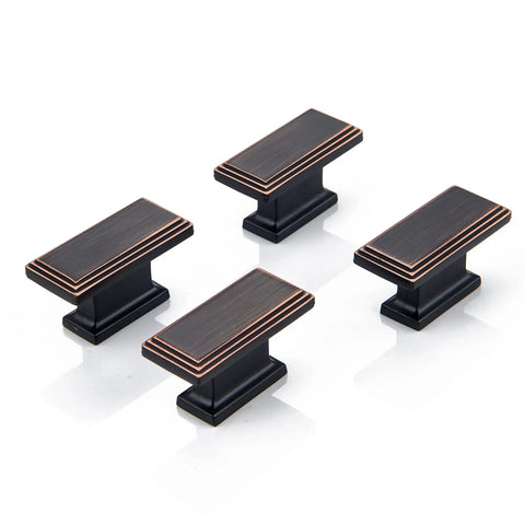 Built Tough Rectangular Cabinet Knobs Ten Pack Oil Rubbed Bronze Finish Heavy Duty Solid Metal Drawer Pulls For Kitchen Cabinets And Custom Storage Shelves. Four bronze cabinet pulls with decorative edging.
