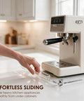 No Sweat Acrylic Appliance Sliders With Silent Rubber Rollers For Coffee Makers And Kitchen Gadgets To Move Heavy Gear Around The Counter Smoothly And Protect Your Cabinet Floors shown with an espresso machine on a clear base.