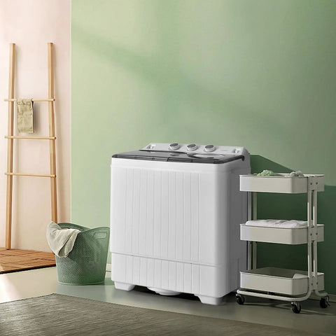 Compact Twin Tub Portable Washing Machine With Separate Wash And Spin Dryer Dual Timer Knobs Auto Drain Pump Fits Any Small Room Light Grey White in a modern laundry space.
