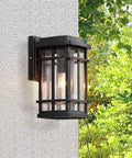 Rock Solid Outdoor Wall Lantern With Frosted Glass Cover And Heavy Duty Die Cast Aluminum Mount Hella Weather Resistant slick modern fixture mounted on a wall.