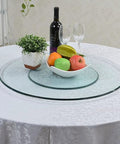 Round Lazy Susan Turntable With Smooth Aluminum Bearings And Heavy Duty Tempered Glass Swivel Serving Tray For House Parties Family Dinners And Holiday Feasts Easy Breezy Cleanup 34 Inch on a dining table with fruits and wine.