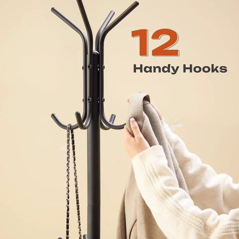 Person using All In One Freestanding Coat Rack Stand With Built In Umbrella Holder And Hat Hanger 12 Hooks Space Saving Metal Organizer