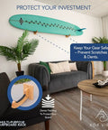 Premium Solid Oak Wood Surfboard Wall Mount Rack With Extra Accessory Hook Holds Surfskateboards Snowboards Wakeboards Heavy Duty Wooden Board Hanger displayed in stylish living room, highlighting dense padding for protection.