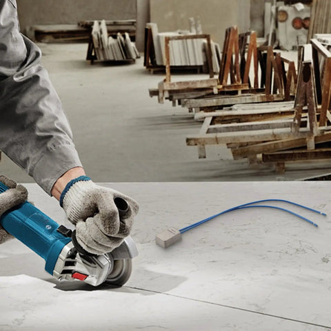 Hardcore Soft Start Module For Angle Grinder 15A 250V beside angle grinder on work surface, shows installation use and workspace.