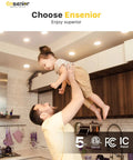 Man lifting child in kitchen under Six Pack 4 Inch LED Recessed Light Dimmable 5000K Daylight 750LM Ultra Thin Canless Wafer Ceiling Light