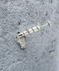 Zinc hollow wall anchor from Tool Free Self Drilling Drywall Anchors Kit 100 Pcs mounted on drywall.