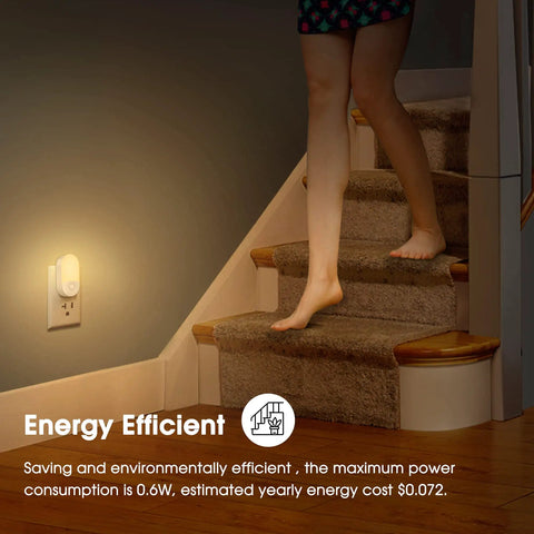 Person walking down stairs with Two Pack LED Night Lights Plugs Into Wall, Dimmable With Light Sensor, Soft White 3000K illuminating steps.