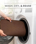 Top Shelf Microfiber Dish Drying Mat Extra Large 18 X 24 Inch Countertop Pad being placed in washing machine for easy cleaning.
