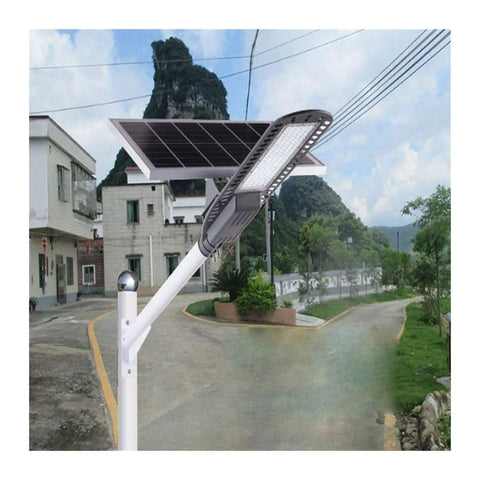 Heavy Duty 120W Solar Street Light With Motion Sensor Tough Aluminum Housing mounted on a pole illuminating a pathway.