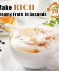 Rechargeable Handheld Milk Frother With Two Stainless Steel Whisk Heads And Three Speed Settings creating frothy cappuccino