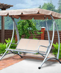 Beige Outdoor Swing Canopy Replacement Top Cover Easy Fit All Weather Rainproof Dustproof Weatherproof With Durable 190T Polyester Taffeta Includes Swing Cushion Cover For Patio Furniture And Garden Seats on a metal frame swing in garden setting