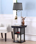 Madison Compact Side Table With Integrated Floor Lamp USB Port And LED Bulb next to a white armchair in a modern room setting