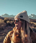 Woman wearing Top Shelf Shatterproof Sunglasses And Work Safety Shades Featuring Premium Polarized Grey Lenses For Men And Women Encased In A Dope Gloss Tortoise Build Packing Serious Uv Defense, outdoors with mountains in background.
