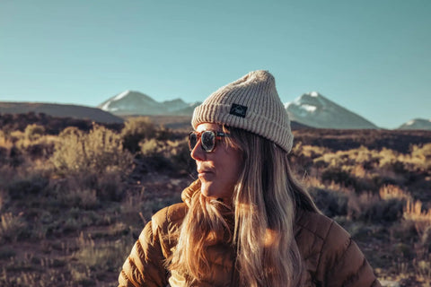 Woman wearing Top Shelf Shatterproof Sunglasses And Work Safety Shades Featuring Premium Polarized Grey Lenses For Men And Women Encased In A Dope Gloss Tortoise Build Packing Serious Uv Defense, outdoors with mountains in background.