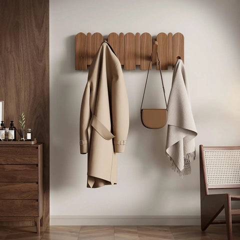 Walnut Wood Coat Rack Wall Mount With Eight Retractable Hangers And Two Dedicated Key Hooks displayed holding a coat and bag.