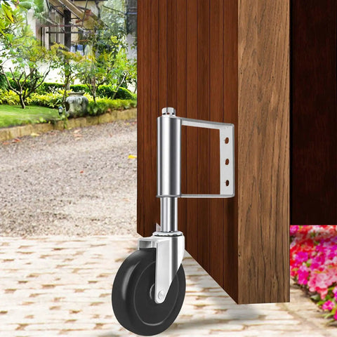 Heavy Duty Spring Loaded Gate Caster Wheel 4 Inch Silver Roller With Smooth Ride Mechanics For Backyard Fence Gates installed on a wooden gate.