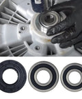 Kick Start Your Laundry Hunka Junk Setup With Smooth Abec Five Bearings And Heavy Duty Twin Lip Gasket To Squash Dang Loud Vibrations And Halt Water Leaks On Lg Kenmore Washers. Worker installing ABEC 5 bearing on washer drum.
