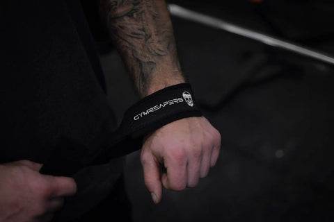 Sick Grip Black Cotton Lifting Wrist Straps Featuring Hella Padded Neoprene Cuffs, close-up of wrist strap on a hand.